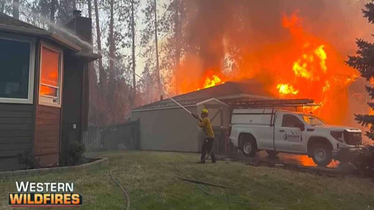 A fast-moving wildfire forces more than 20,000 people to evacuate in western Canada