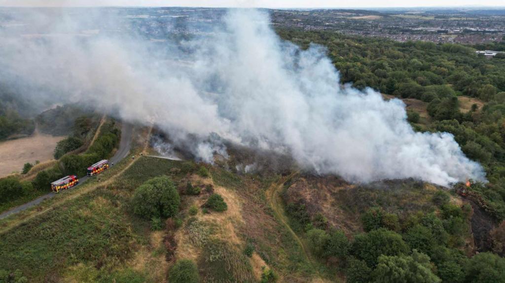 Crews remain at scene of country park fire