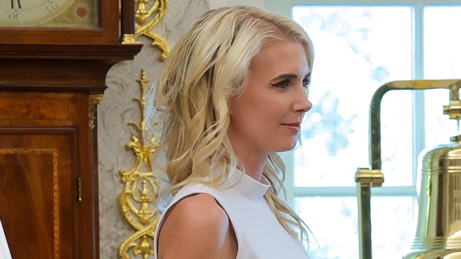 Trump’s Blonde Companion Natalie Harp, 35, Can’t Stop Smiling as Chaos Swirls