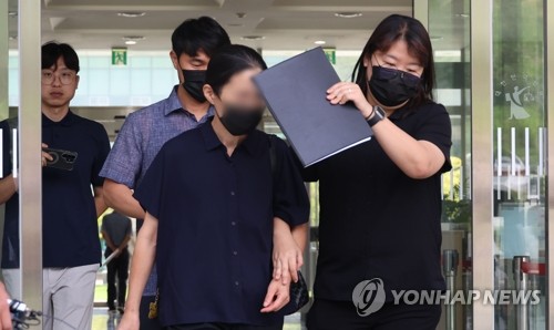 Court holds arrest warrant hearing for woman over fatal abuse of grandson