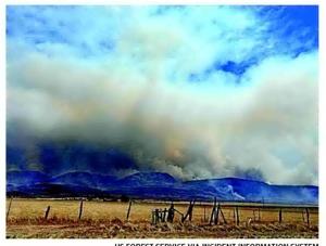 Thousands evacuated as crews battle nearly 200 US wildfires