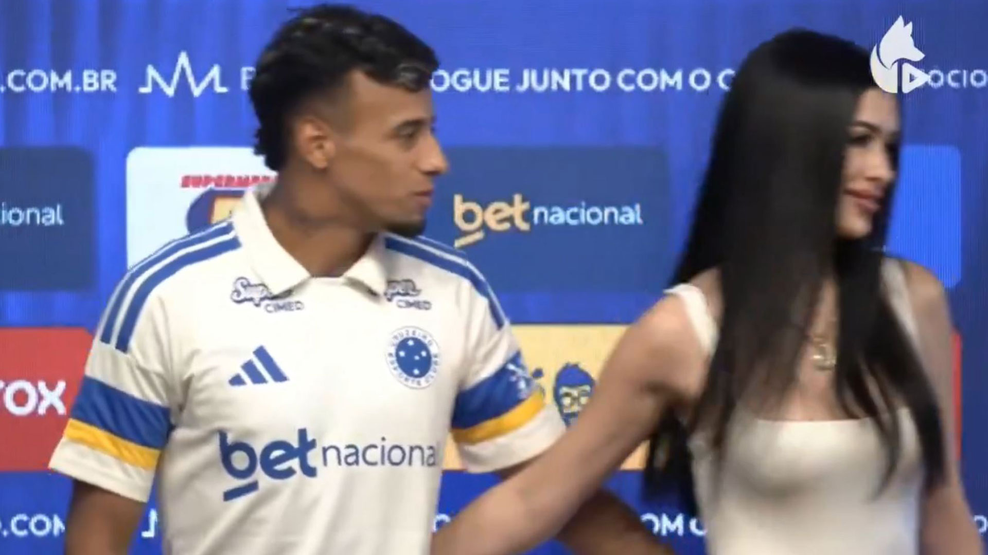 Awkward moment new signing left hanging by his girlfriend as he goes to kiss her at transfer unveiling