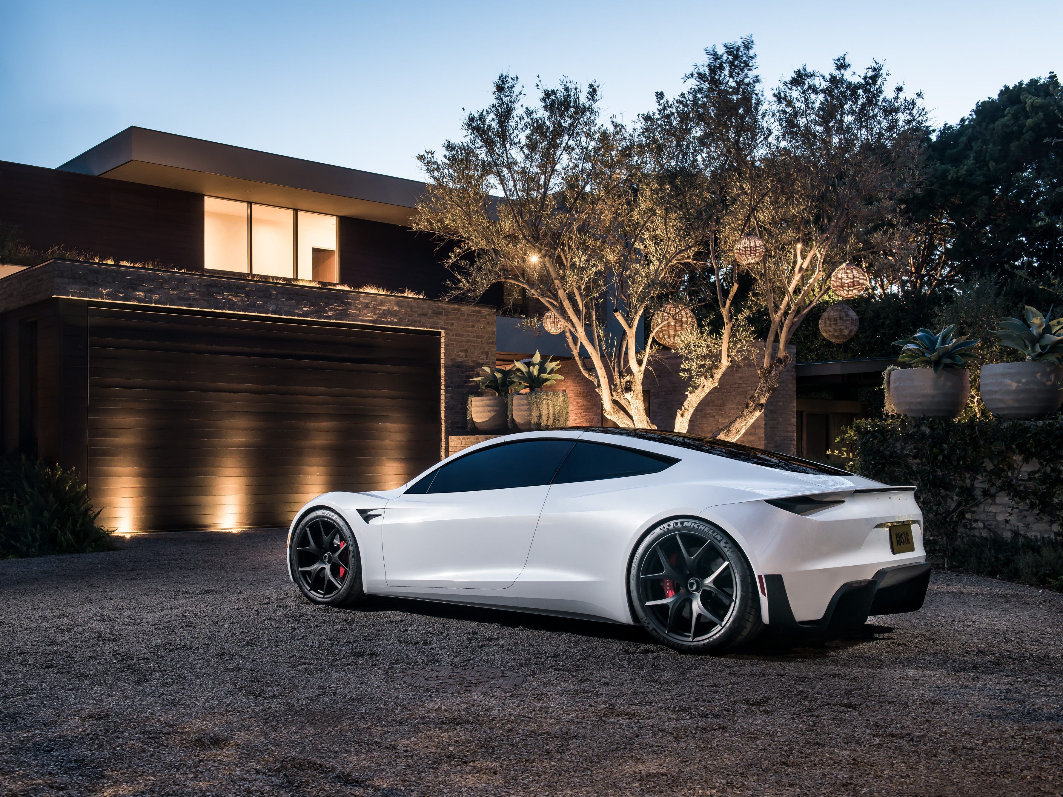 Tesla's design chief says Roadster's reveal is coming 'very soon'