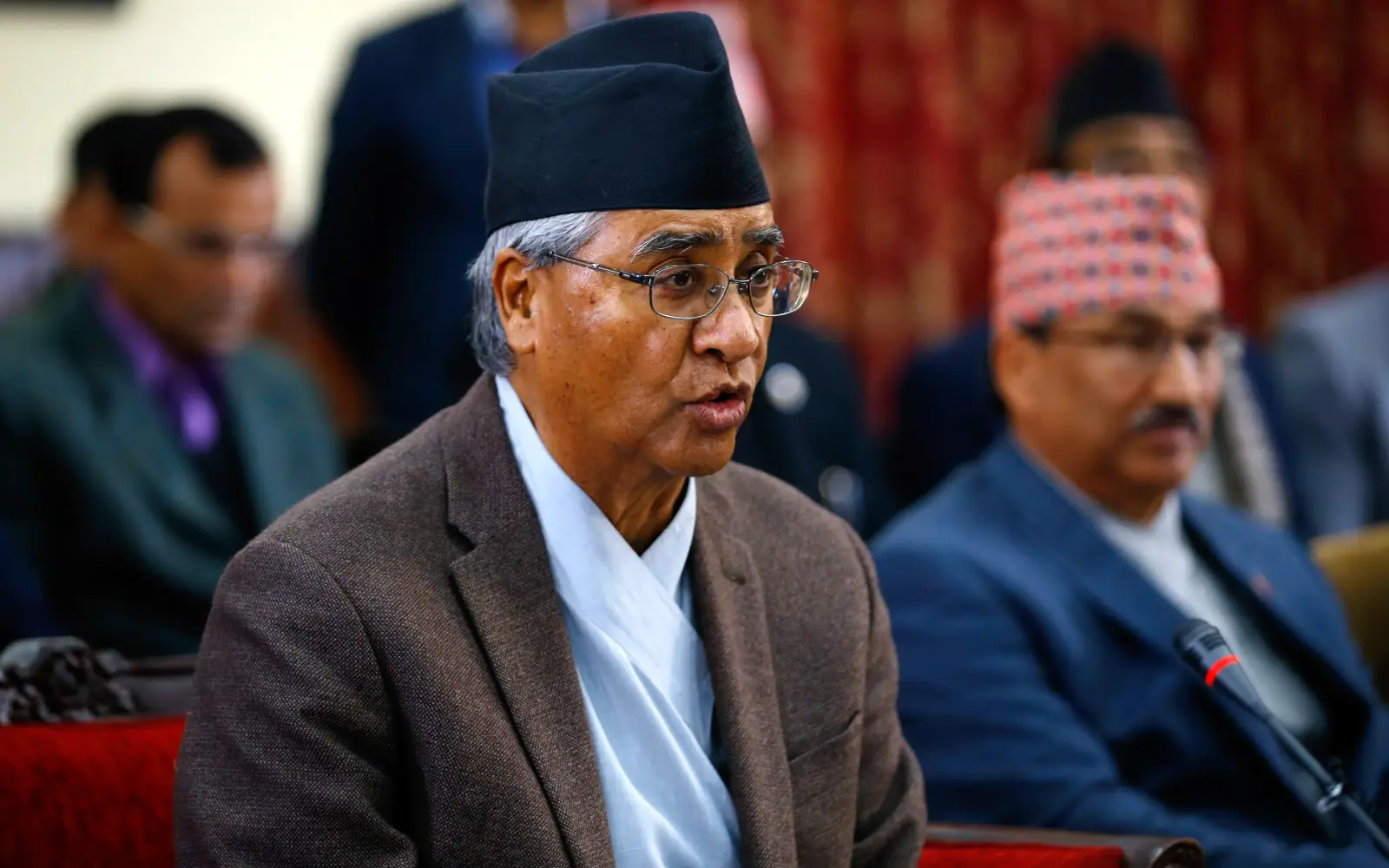 Former Nepali premier Deuba returns home, faces graft probe