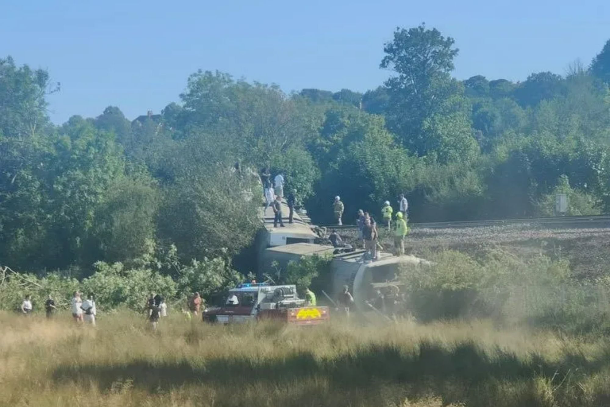 Passenger train derails as emergency services flood track and line closed