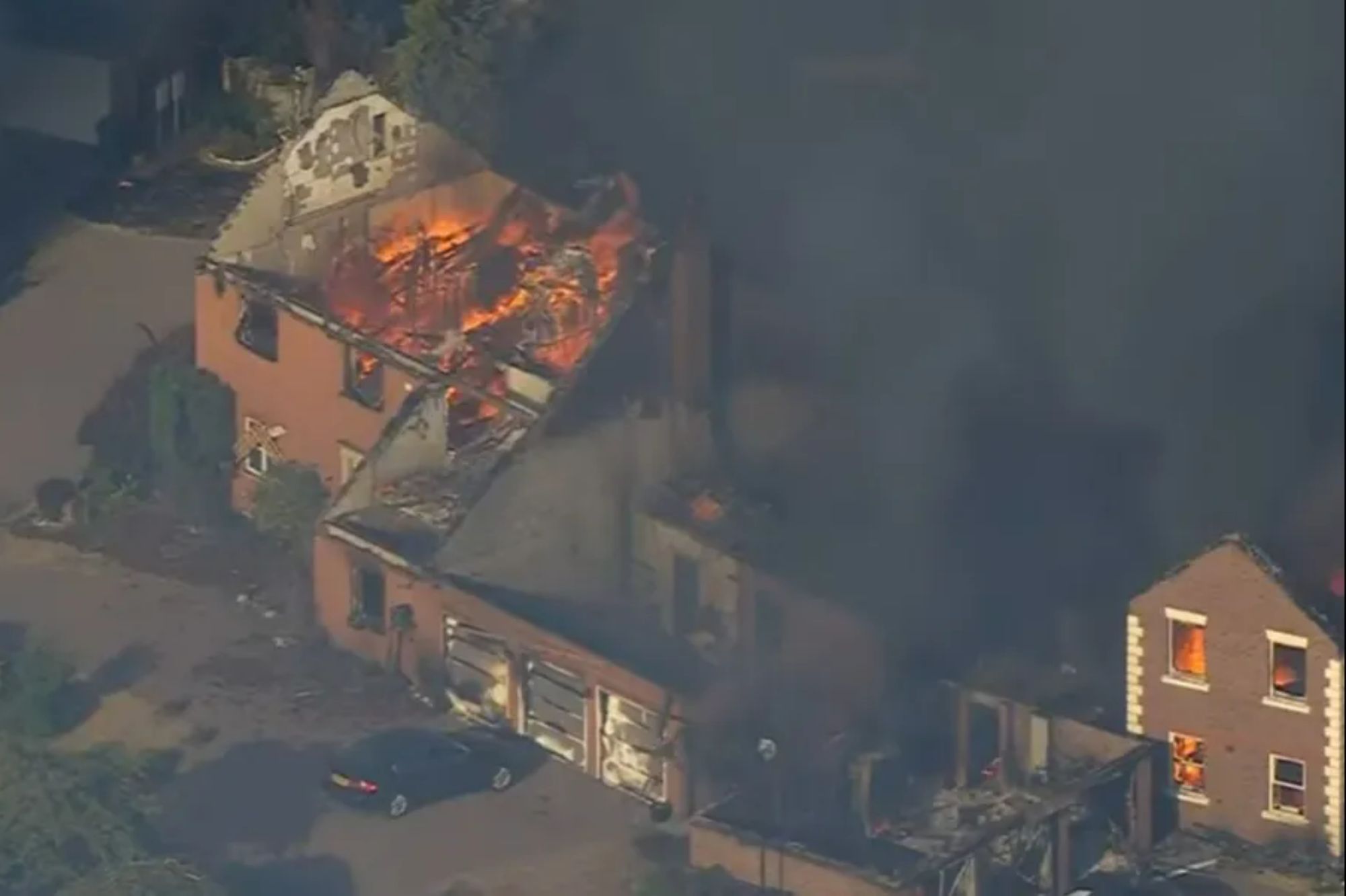 Inferno rips through homes after wildfire spreads as major incident declared after blazes erupt around UK