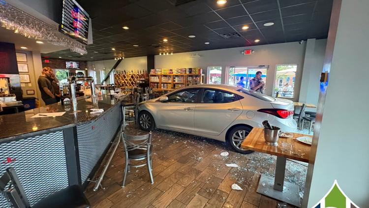 Four hurt after car plows through popular Harrisburg bottle shop