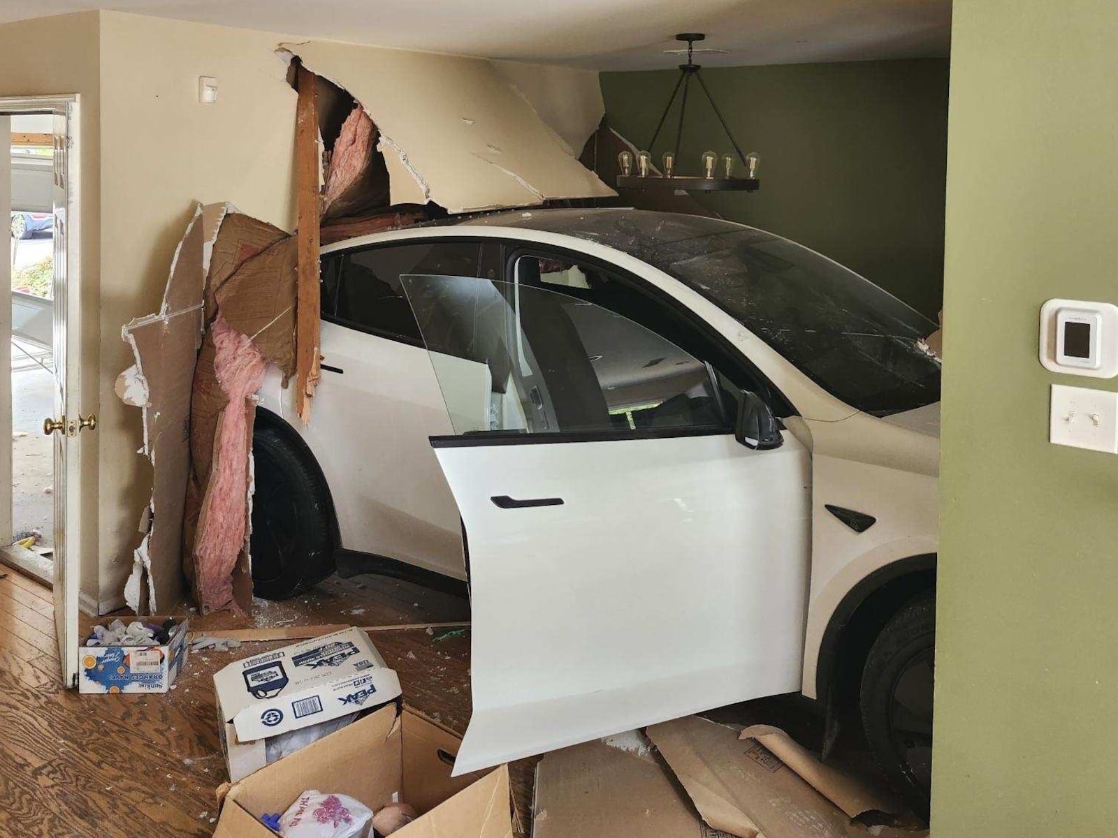 Tesla ends up in a kitchen after crashing into N.J. home, police say