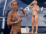 Rita Ora shows off her incredible figure in a mismatched bikini before enjoying a spot of snorkelling during sun-soaked yacht trip with pals in Ibiza