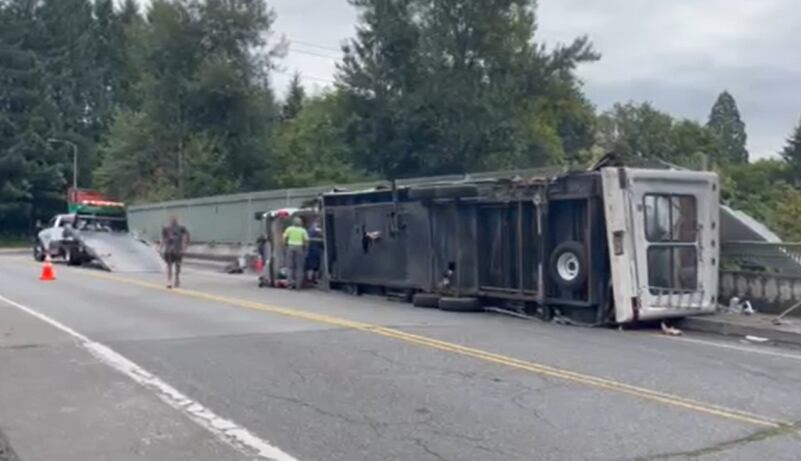 Truck pulling travel trailer rolls on Highway 26 overpass near Oregon Zoo