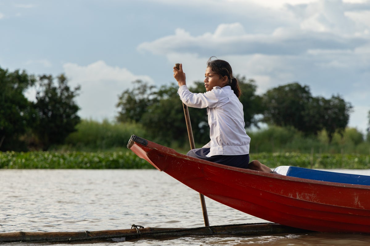 Photos show Cambodian children attend school in floating villages along the Tonle Sap lake.