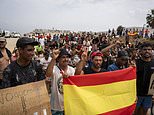 Hundreds of Ceuta migrants stage protest demanding Spain asylum after being left sleeping on beach following 'invasion' - as medics fight disease outbreaks