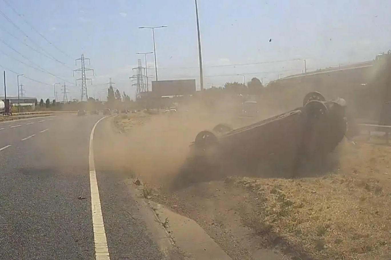 Shocking moment car flips onto roof after smashing into another driver on busy A-road – leaving three in hospital