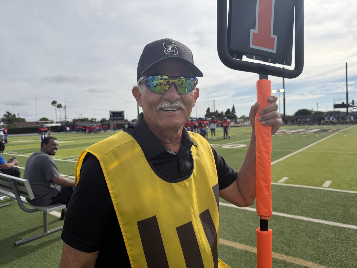 Prep talk: Val Moreno begins his 33rd year on chain crew for Servite home games