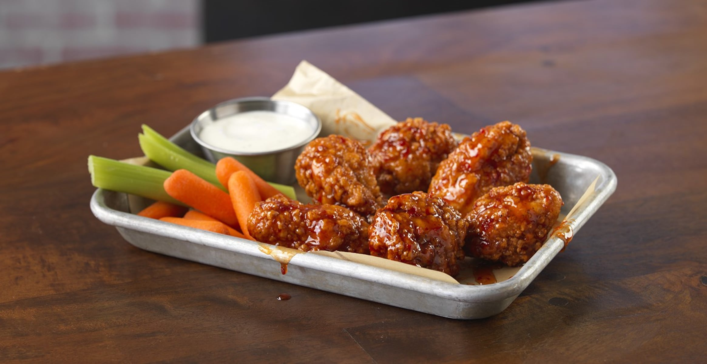 2 beloved restaurant chains known for wings, subs to open under same roof