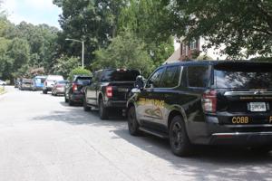 UPDATE: SWAT officers arrest suspect after south Cobb house fire