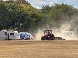 Council try to block travellers from entering field with 'ring of steel' and use tractor to kick up dust and force caravans out