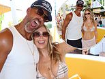 Kate Ferdinand flaunts her jaw-dropping curves in a pink Burberry bikini as she and Rio live it up at O Beach, Ibiza - after hitting back at 'gold digger' accusations