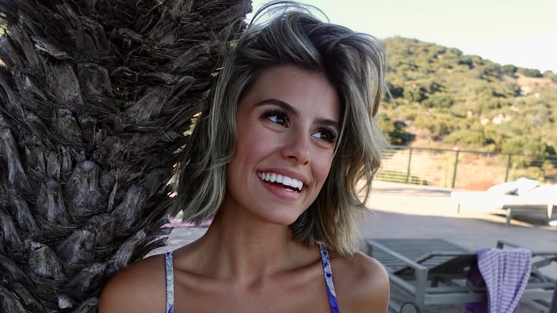 Nickelodeon star Madisyn Shipman, now 23, bursts out of tiny blue bikini as she poses with palm trees