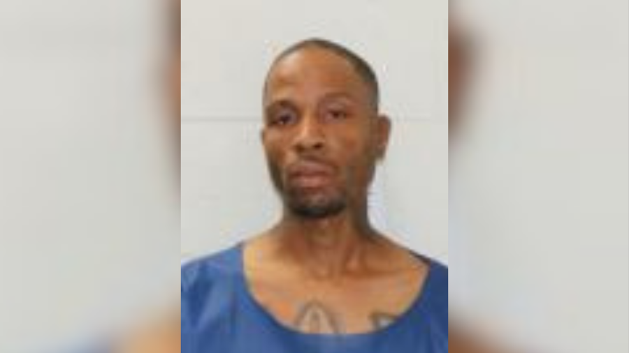 Man charged with killing Kansas City woman before setting house on fire