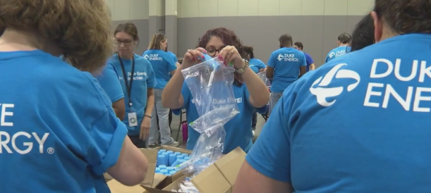 Volunteers assemble 10,000 hygiene and inclement weather kits for those in need