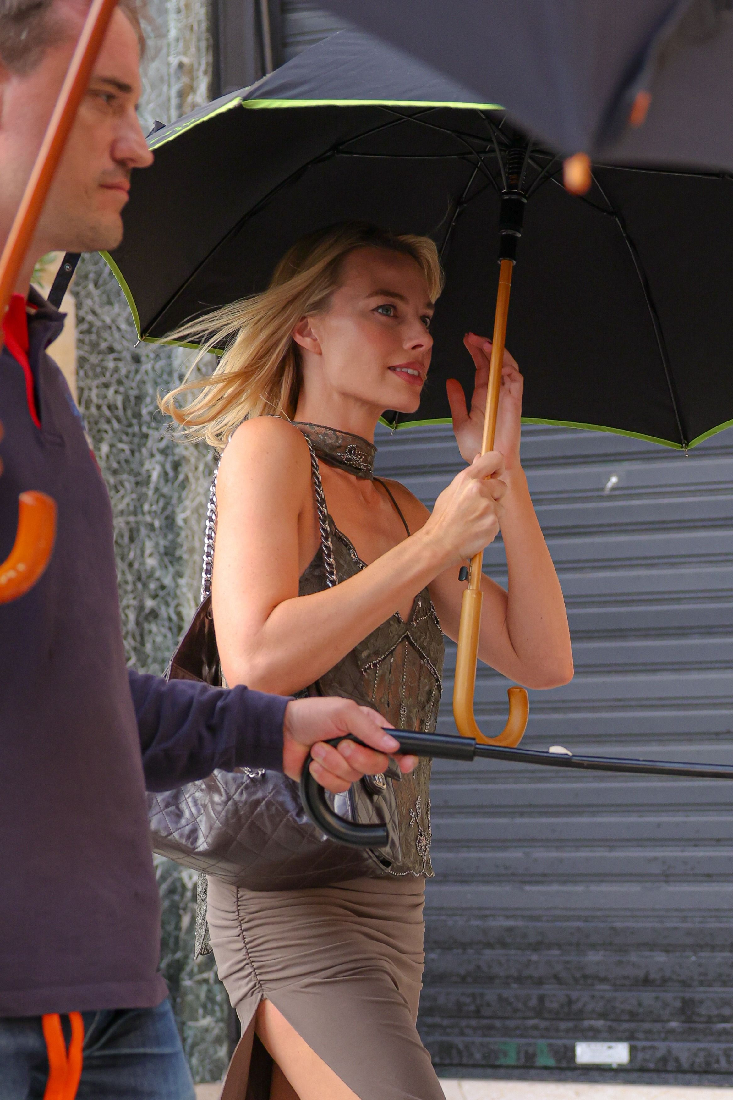 In Rainy Paris, Margot Robbie Finds the Chicest Possible Solution