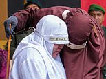 The caning so severe even the flogger took pity: Four people are whipped a HUNDRED times each for adultery before 'algojo' whispers support to one woman