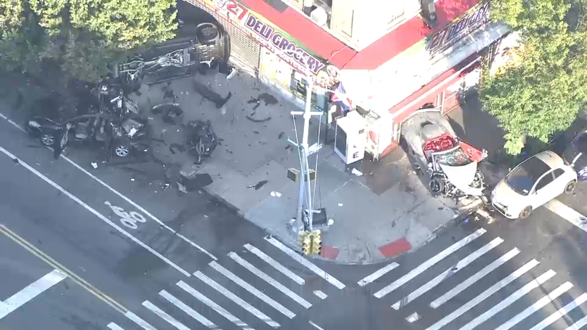 3 cars crash, jump sidewalk in Inwood, critically injuring at least 1 person