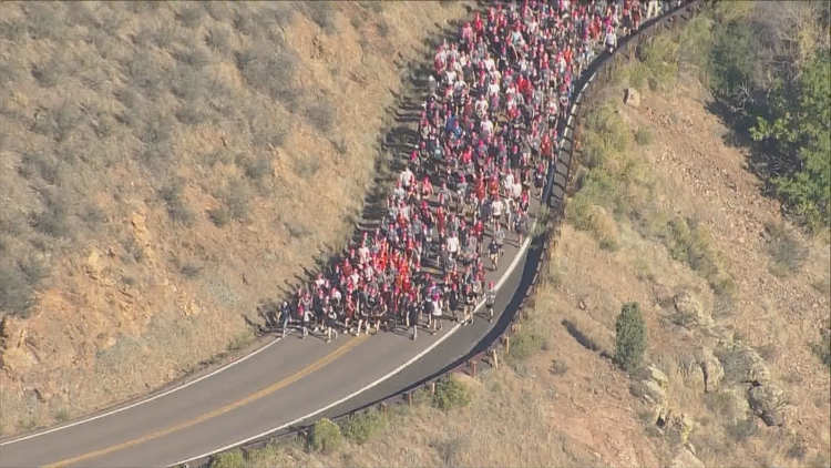 Mines students carry rocks up Golden mountain in 118-year-old school tradition