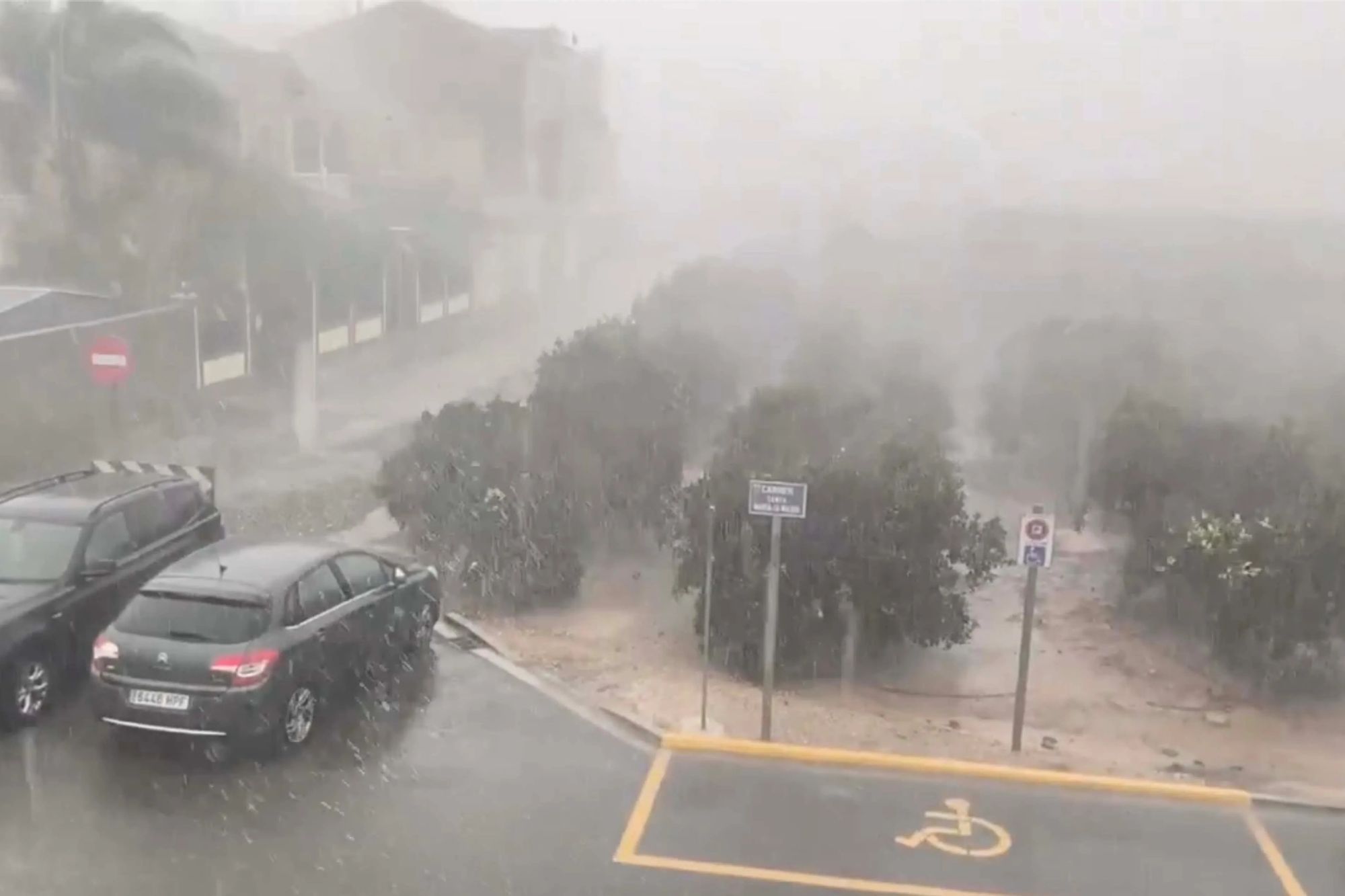 At least three rushed to hospital after being crushed by collapsing wall in Spain as storm batters holiday hotspot