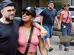 Damon Albarn looks loved up with new girlfriend Rebecca Freckleton during cosy stroll as they 'take their romance to the next level' - four years after his split from ex Suzi Winstanley